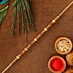 Traditional Golden Pearl Rakhi With 100 Gms Almonds