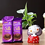 Money Plant in Girl Resin Pot & Cadbury Chocolates