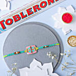 /images/pr/australia/l/v20240813180443/floral-fantasy-rakhi-n-toblerone-delight_1.jpg