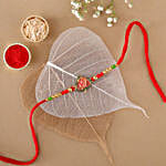 /images/pr/canada/l/v20220630200057/sneh-exclusive-om-leaf-rakhi_1.jpg