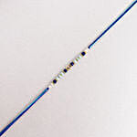 /images/pr/indonesia/l/v20240711130355/cerulean-blue-simple-dhaga-rakhi-sweets-and-nuts-combo_7.jpg