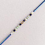 /images/pr/indonesia/l/v20240711130355/cerulean-blue-simple-dhaga-rakhi-sweets-and-nuts-combo_8.jpg