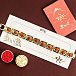 /images/pr/mauritius/l/v20240711125801/glamorous-gold-embellished-rudraksh-rakhi-n-nutty-delight_2.jpg