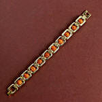 /images/pr/oman/l/v20240711132431/glamorous-gold-embellished-rudraksh-rakhi-n-nutty-delight_7.jpg