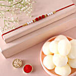 /images/pr/qatar/l/v20240726111041/sneh-red-white-pearl-rakhi-rasgullas_1.jpg