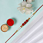/images/pr/qatar/l/v20240726111048/sneh-white-pearls-rakhi-sweets-tin_2.jpg