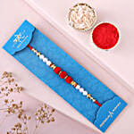 /images/pr/qatar/l/v20240726111048/sneh-white-pearls-rakhi-sweets-tin_4.jpg