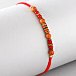 /images/pr/l/v20220713114530/sneh-stunning-crisp-pearl-rakhi_2.jpg
