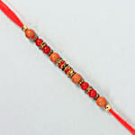 /images/pr/l/v20220713114530/sneh-stunning-crisp-pearl-rakhi_3.jpg