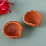 /images/pr/l/v20220929185444/almonds-raisins-potlis-with-4-clay-diyas_3.jpg