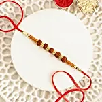/images/pr/l/v20240628174833/celestial-charms-rudraksha-rakhi-n-almond-soan-papdi-gift-set_5.jpg
