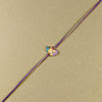 /images/pr/l/v20240628190136/bal-ganesha-cheerful-charm-rakhi_3.jpg
