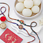 /images/pr/singapore/l/v20240717091909/vibrant-ganesh-and-om-rakhi-duo-n-rasgulla-delight_1.jpg