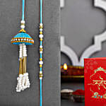 /images/pr/spain/l/v20240711131657/tranquil-teal-jhumar-bhaiya-bhabhi-pearl-rakhi-set-n-sweet-treats_6.jpg
