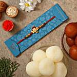 /images/pr/sweden/l/v20210715155120/ganesha-face-kids-rakhi-with-gulabjamun-and-rasgulla_1.jpg