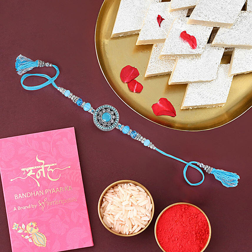 /images/pr/uae/l/v20240202185832/sneh-american-diamond-elegant-rakhi-kaju-katli_1.jpg
