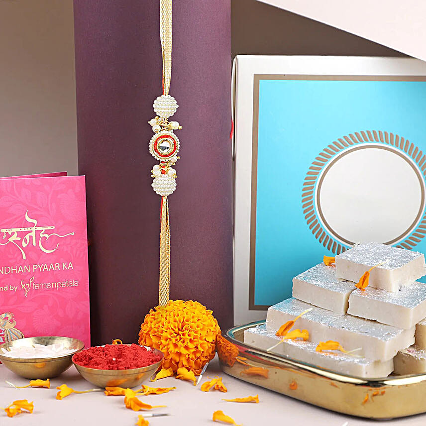 /images/pr/uae/l/v20240723100739/crimson-majestic-pearl-rakhi-n-kaju-katli-combo_1.jpg