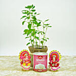 1 tulsi plant wrapped in a jute mat with laxmi and ganesha idol, 1 kg haldiram gulab jamun, 1 brass diya