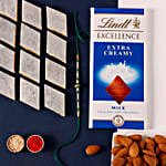 /images/pr/uae/l/v20220709125333/sneh-fancy-green-rakhi-with-lindt-chocolate-bar-and-almonds-and-kaju-katli_1.jpg