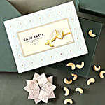 /images/pr/uae/l/v20220726164834/sneh-fancy-green-rakhi-with-lindt-chocolate-bar-and-almonds-and-kaju-katli_3.jpg