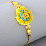 /images/pr/uk/l/v20210726161934/yellow-flower-pearl-rakhi-for-kids_4.jpg