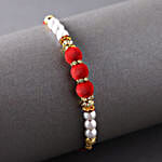 /images/pr/uk/l/v20220707124445/sneh-white-pearls-rakhi-with-sweet-treats_3.jpg