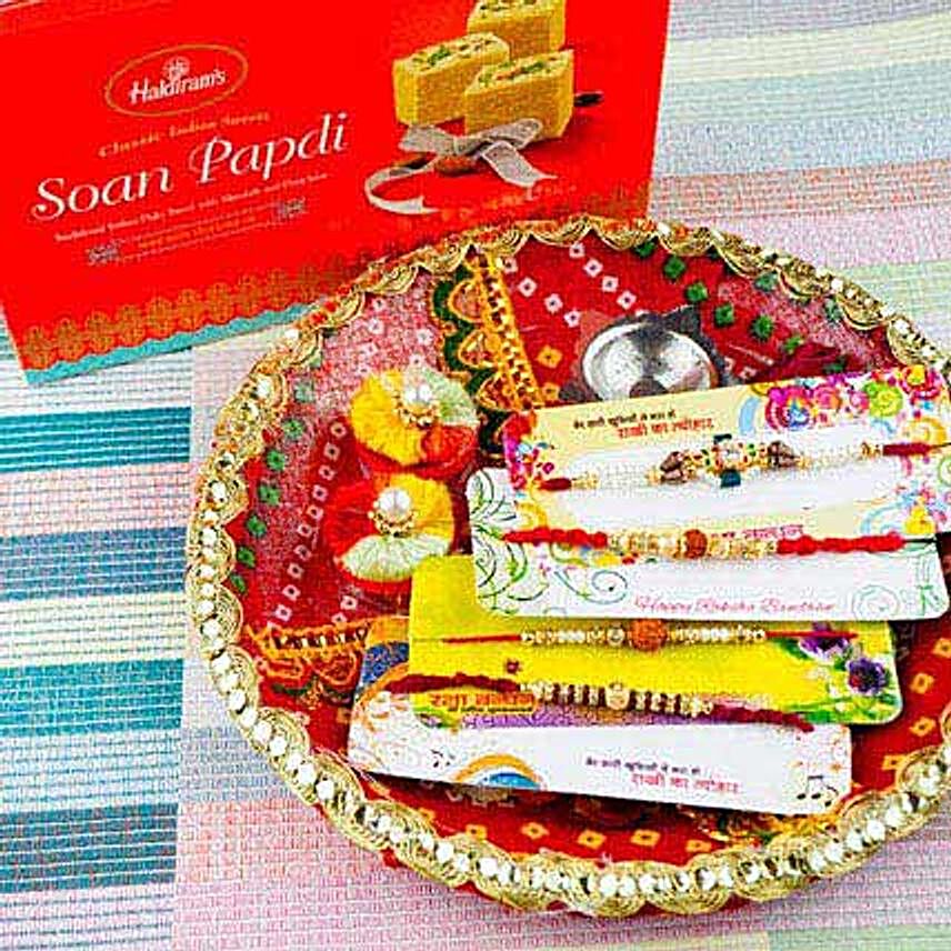 Four Rakhi Set With Soan Papdi and Traditional Thali