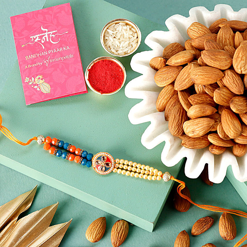 Sneh Designer Peach Rakhi & Almonds:Pearl Rakhi to Australia