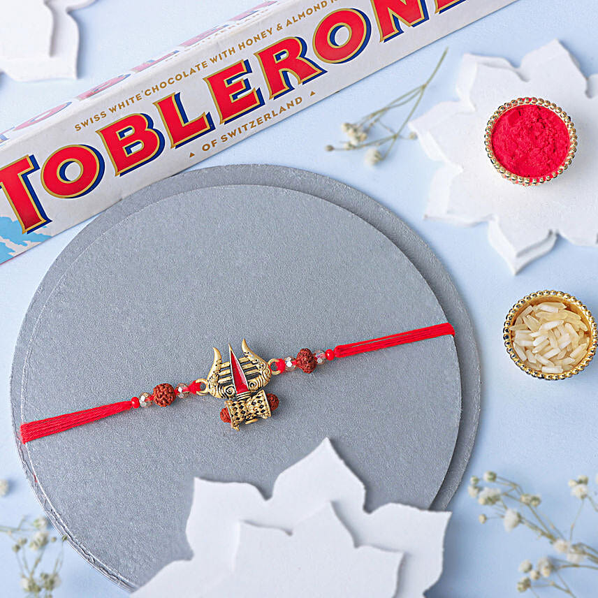 Intricate Trishul Rakhi N Toblerone Delight