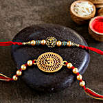 Om And Lion Face Rakhis With Rasgulla