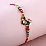 Sneh Elegant Peacock Rakhi & Lindt Bar