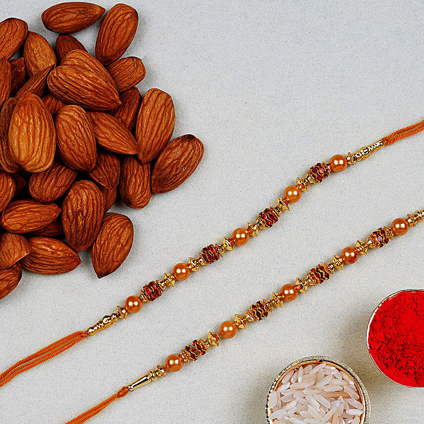 Golden Red Thread Rakhi And Almonds