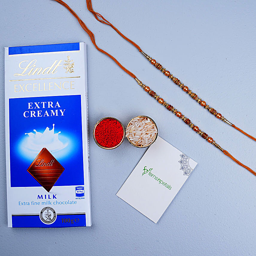 Golden Red Thread Rakhi And Lindt Chocolate:Single Rakhi to Austria