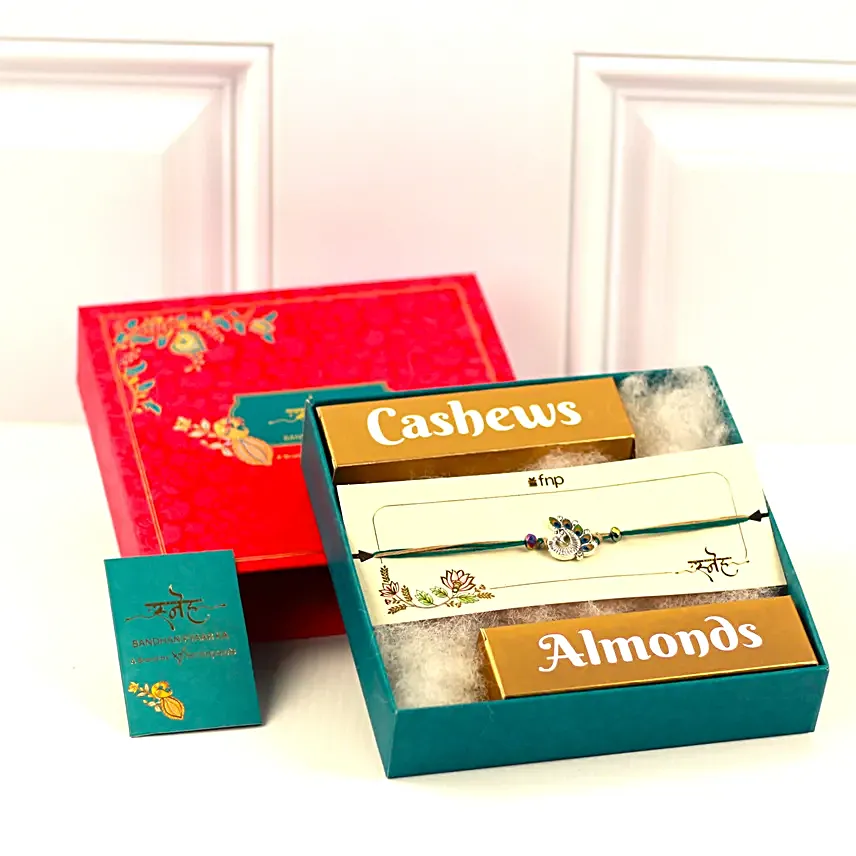 Alluring Peacock Rakhi and Nut Treats