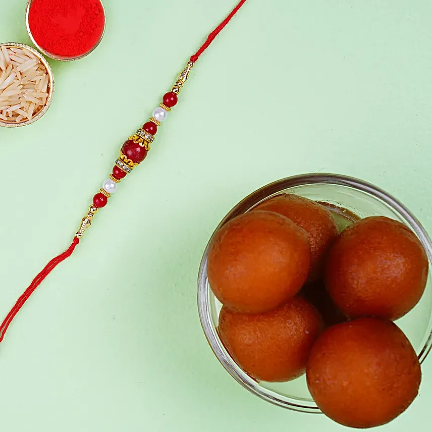 Elegant Pearl Thread Rakhi And Haldiram Gulab Jamun Tin