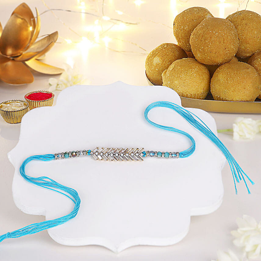 Glittering Grandeur Rakhi N Besan Laddoo Treat