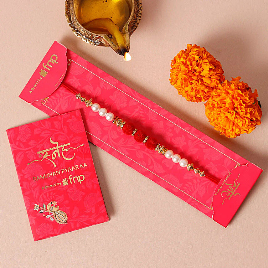 Luxurious Pearl Rakhi N Delights Hamper