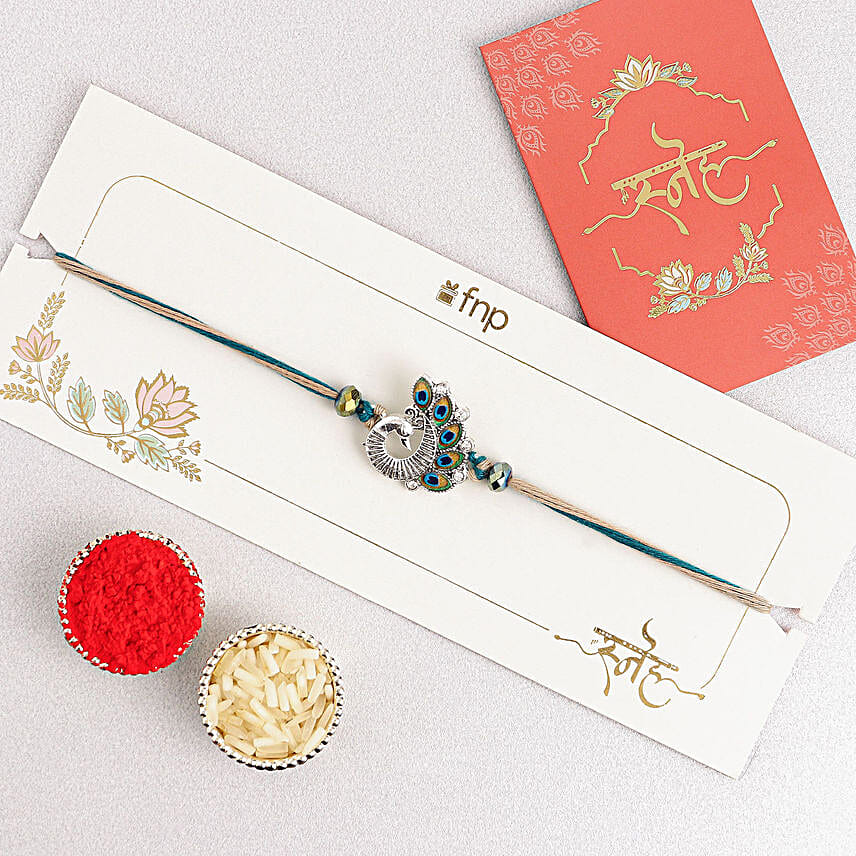 Sapphire Serenity Peacock Rakhi with Dodha Barfi Combo