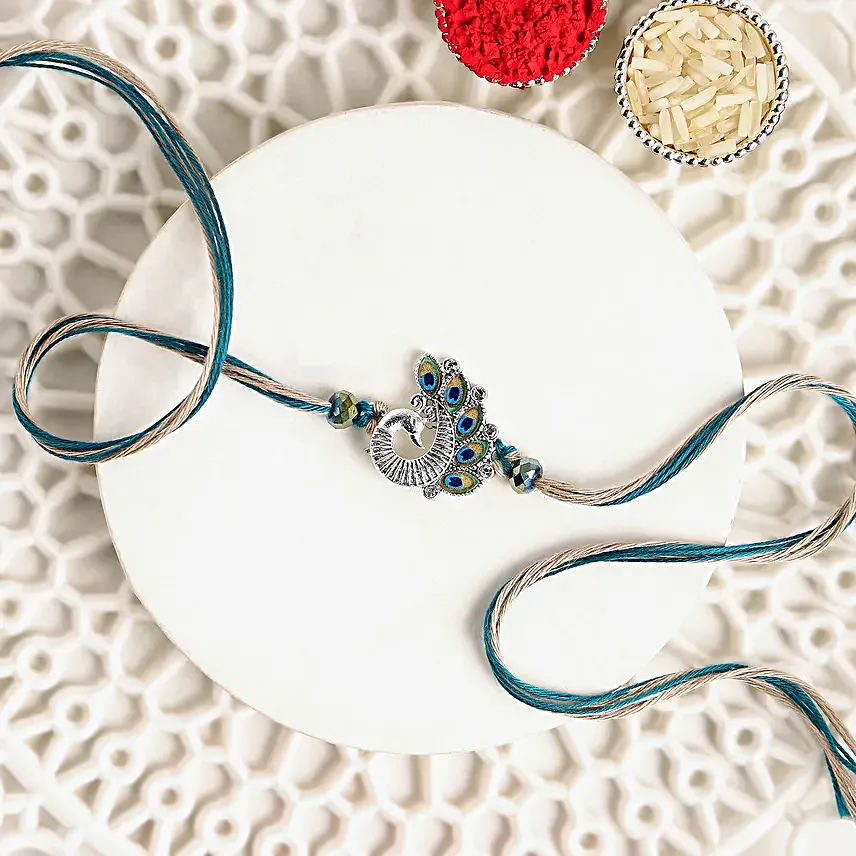 Sapphire Serenity Peacock Rakhi with Dodha Barfi Combo