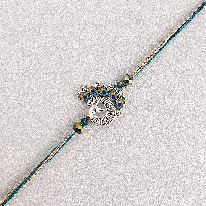 Sapphire Serenity Peacock Rakhi with Dodha Barfi Combo
