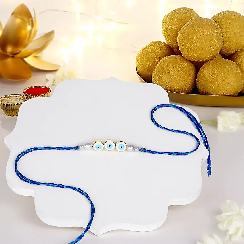 Simplistic Blue Evil  Eye Rakhi N Besan Laddoo Delight