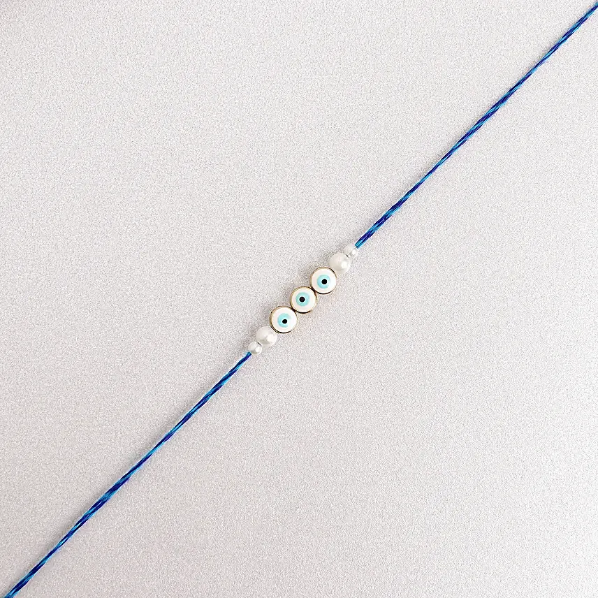 Simplistic Blue Evil  Eye Rakhi N Besan Laddoo Delight