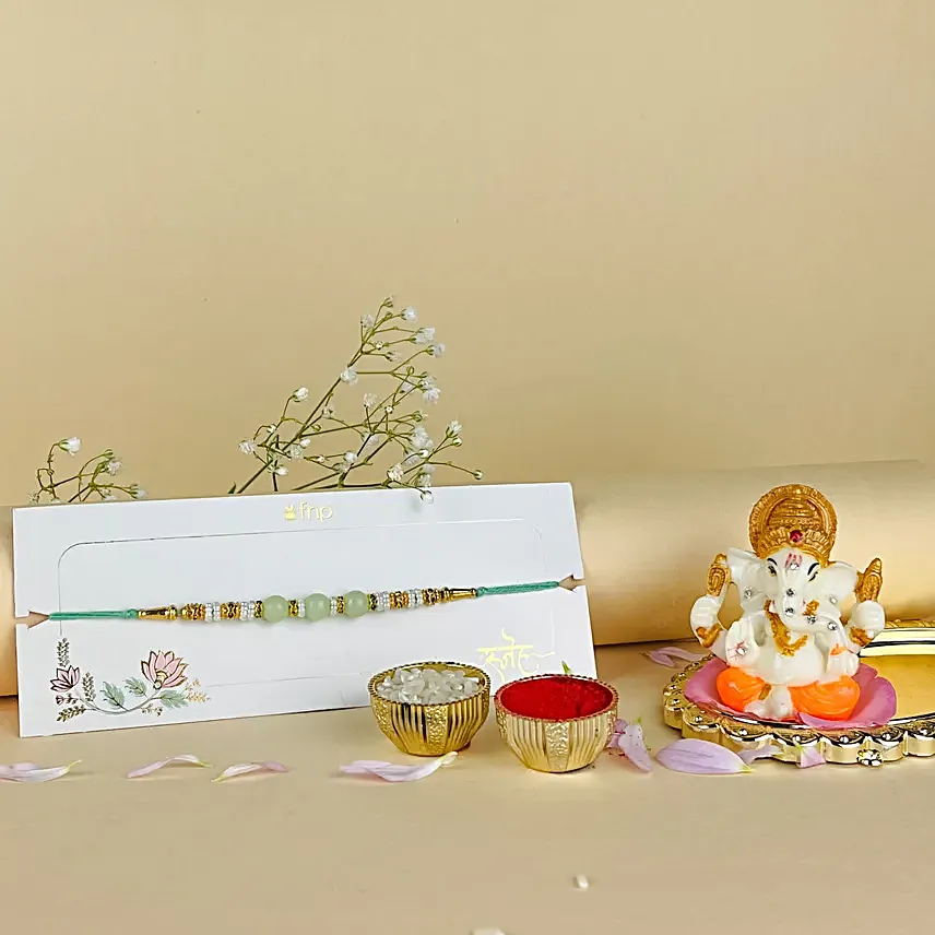 Tranquil Pearls Rakhi N Ganesha Blessings Idol