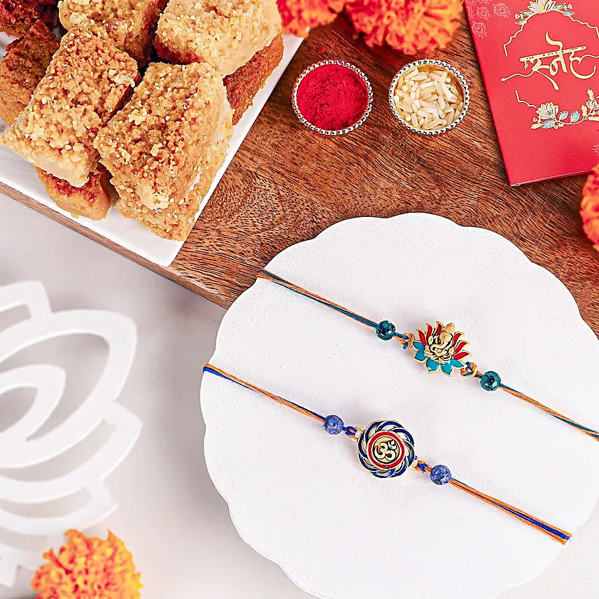 Vibrant Ganesh and Om Rakhi Duo N Milk Cake Delight