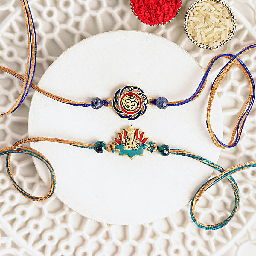 Vibrant Ganesh and Om Rakhi Duo N Sweetness Set