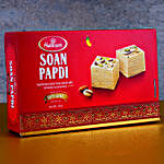 Om And Lion Face Rakhis With Soan Papdi And Almonds