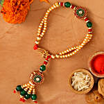 Green Bracelet Style Rakhi And Healthy Almonds