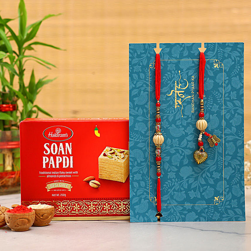 Red Pearl And Lumba Rakhi Set With Soan Papdi