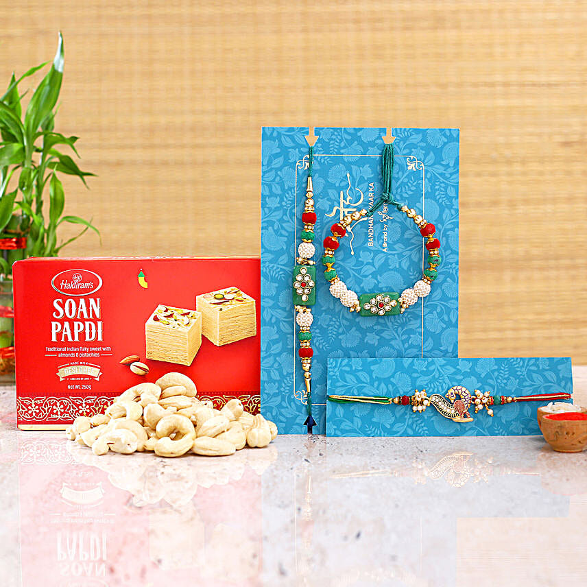 Green Lumba Rakhi Set And Peacock Rakhi With Soanpapdi And Cashew