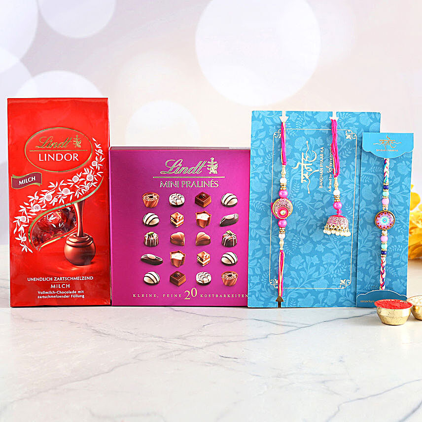3 Classy Rakhis And Delectable Chocolate Hamper